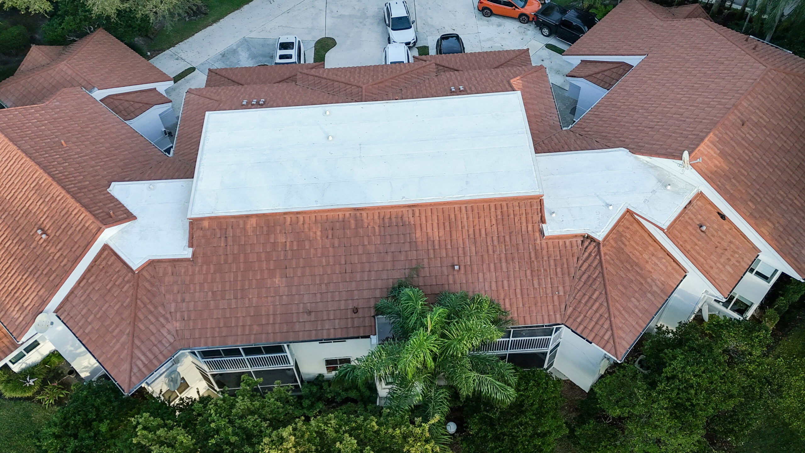 Commercial roofing contractor evaluating a Palm Beach County business roof following a roof leak and weather-related damage.