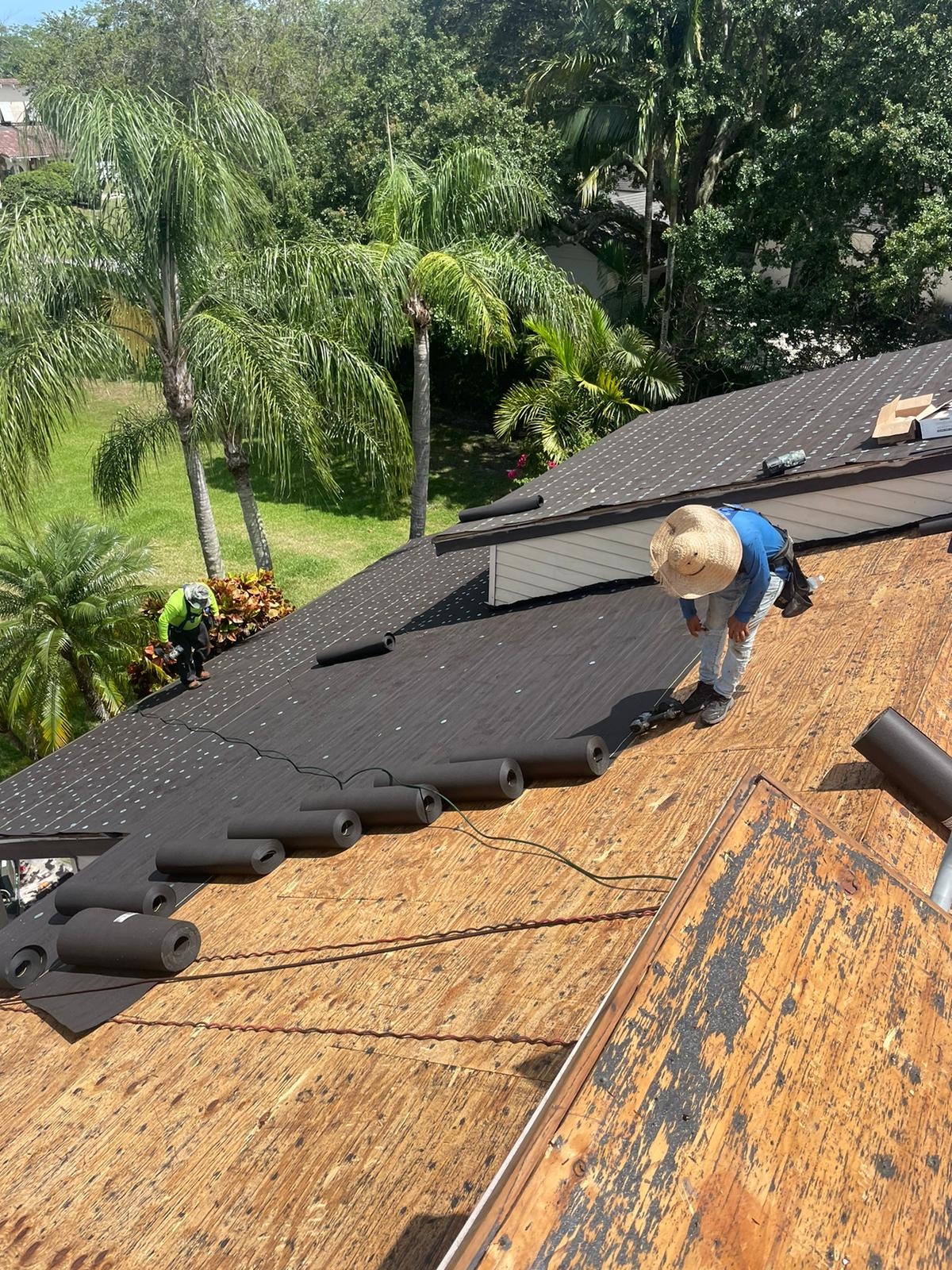 Rainbow Roofing Solutions, LLC explaining the advantages of solar panel roof shingles in Fort Lauderdale, including energy efficiency, modern curb appeal, clean roofing design, and long-term property value.