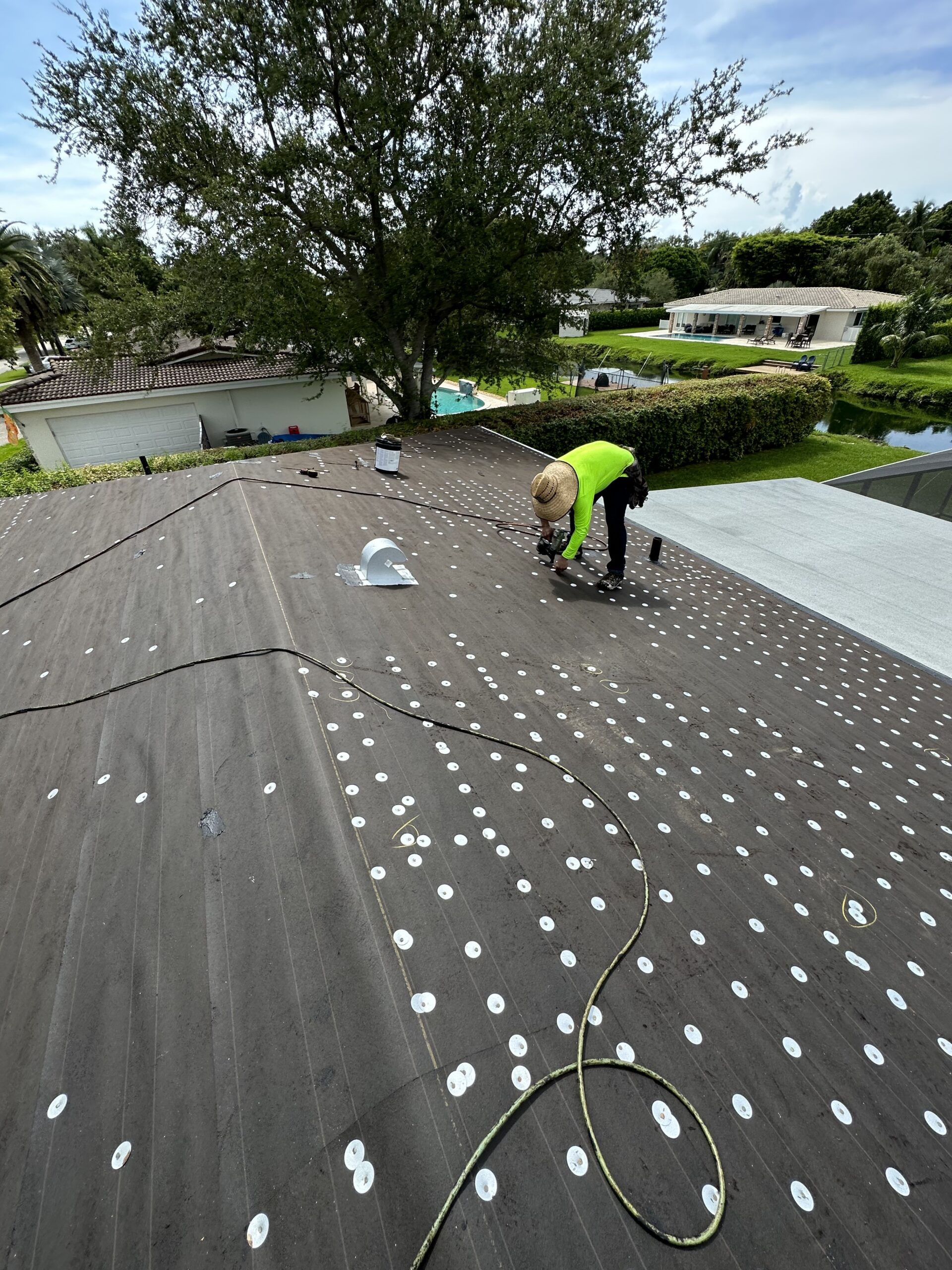 Residential roof in Palm Beach, Florida inspected for repair by Rainbow Roofing Solutions, LLC.