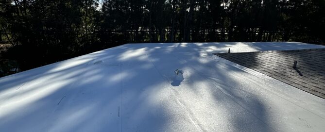 Roofing specialist inspecting a residential roof in Plantation, Florida for leak repair and partial repairs
