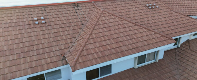 Roof of a single-family home in Lighthouse Point showing shingles and emergency repair work.