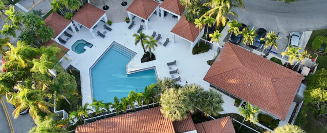 Residential roofing repair team inspecting a home roof in Fort Lauderdale, Florida for a free estimate